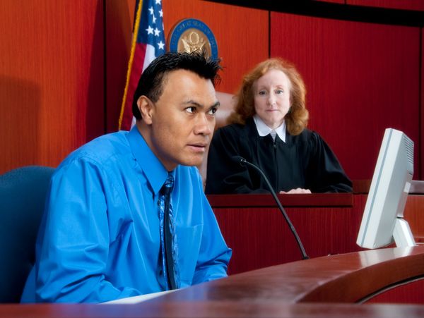 Logo for Wharding Law with a gavel icon on olive background.