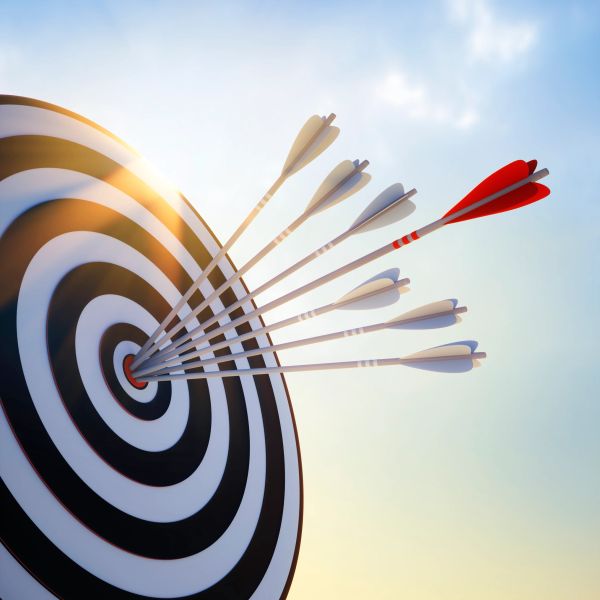 Several arrows hitting the bullseye on a target, one red arrow stands out.
