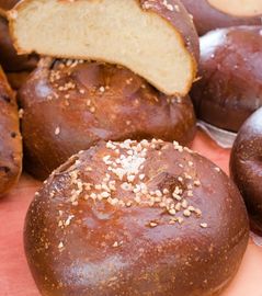 Soft pretzel buns topped with coarse salt.