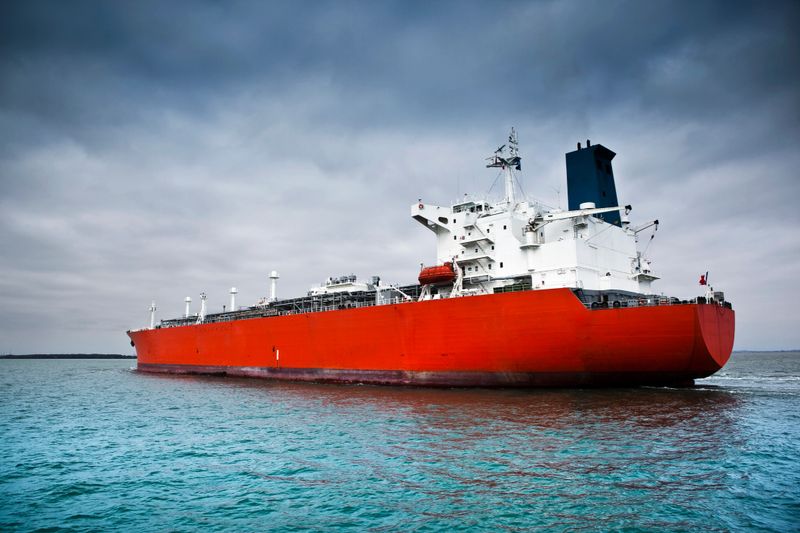 A large modern tanker is delivering gas to an international port