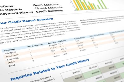Person reviewing credit options on desk.