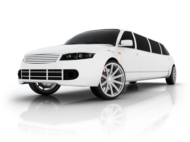 White luxury stretch limousine with tinted windows and modern rims.