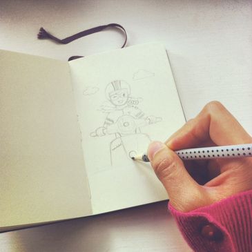 Hand sketching a cheerful person riding a scooter with a dog in a notebook.