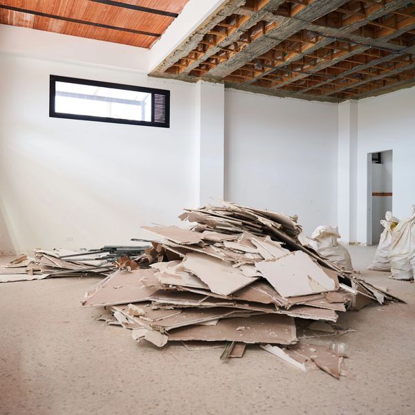 Pile of construction debris in a room under renovation.
