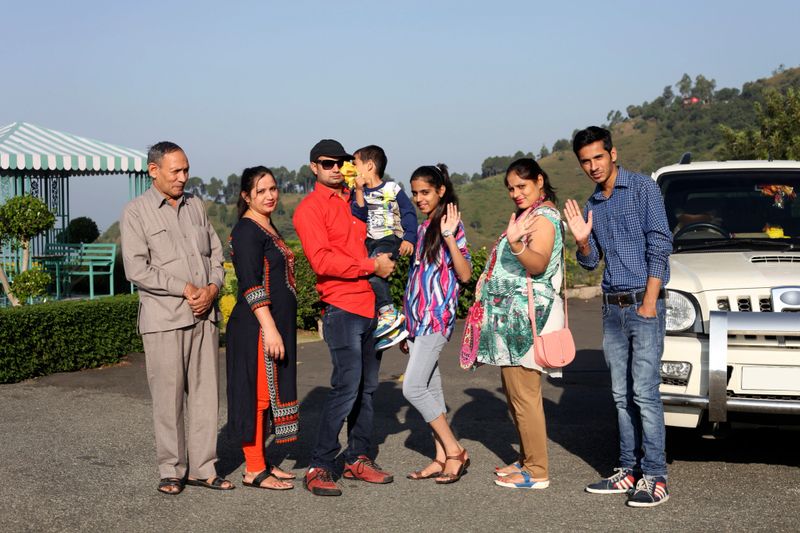 Indian Family on vacation in Shimla, Himachal Pradesh portrait together close up.