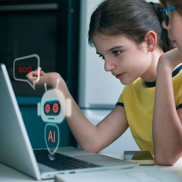 Two girls interacting with AI chatbot on laptop screen.