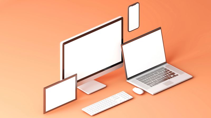 Clean white device mockup set with orange background. Tablet PC , desktop computer mobile and notebook.3d rendering
