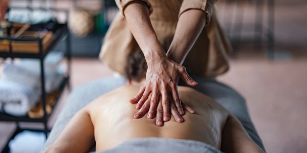 Person receiving a back massage.