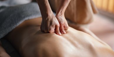 Person receiving a back massage.