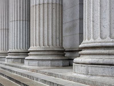Close-up of classical stone columns and steps.