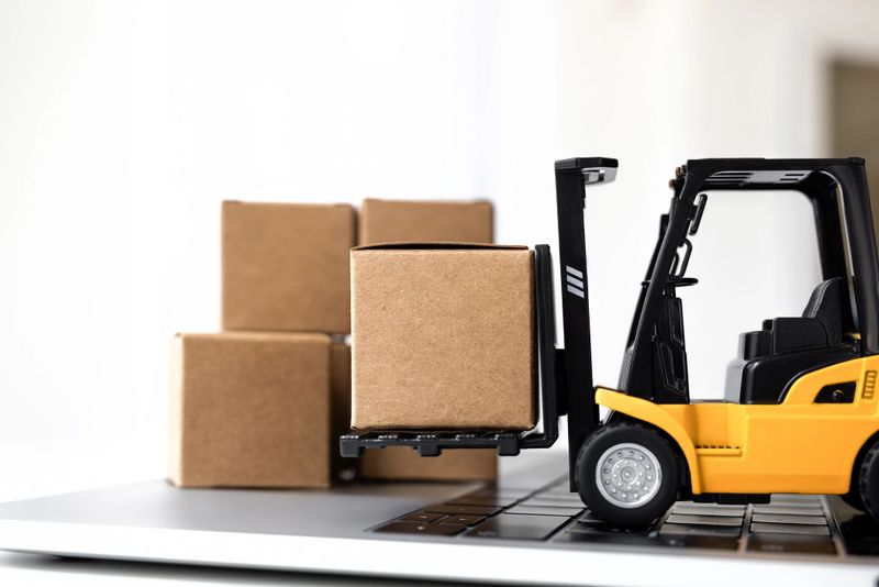 Fork-lift moves boxes