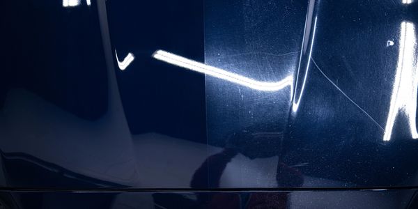 Comparison of car paint surface before and after polishing.