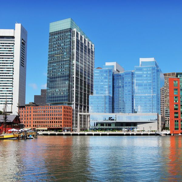 Boston Seaport District buildings by the water near top conference venues.