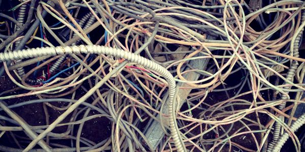 A tangled mess of various wires and cables.