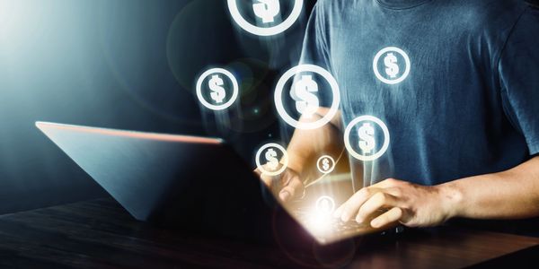 Man using laptop to earn money. 