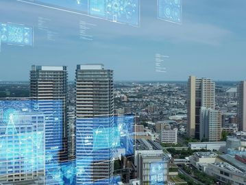 Cityscape with digital data overlay on buildings.