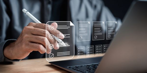 Business owner looking at a laptop view documents required for a complete application