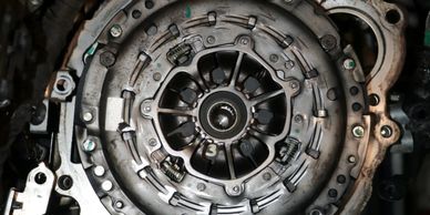 Close-up of a car clutch assembly showing springs and metal components.