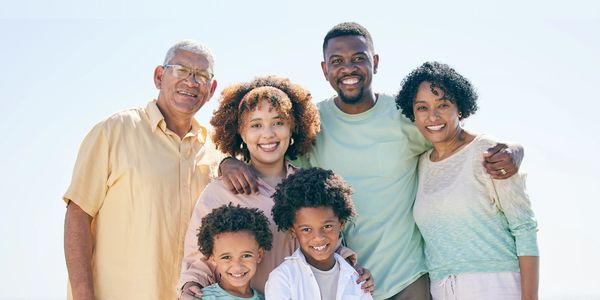 black family multigeneraltional parents grands children smiling 