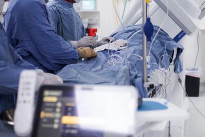 Doctors performing surgery in an operating room.