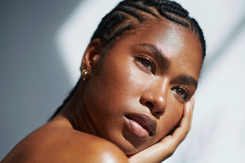 gorgeous black Woman with glowing skin, stock photo, copy space