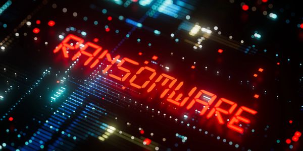 Red neon "RANSOMWARE" text over digital background.