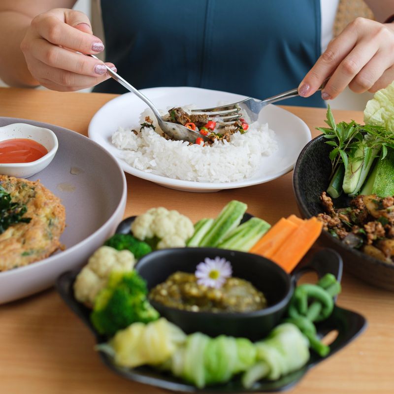 young women eating healthy food in the coffee shop