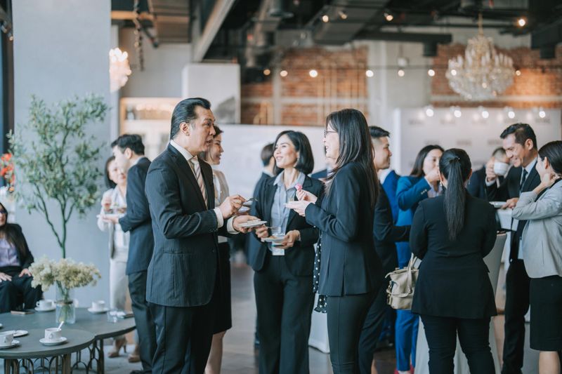 Asian Multiethnic business people talk during a coffee break in Seminar Business conference