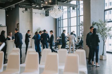 People networking in a modern event space.