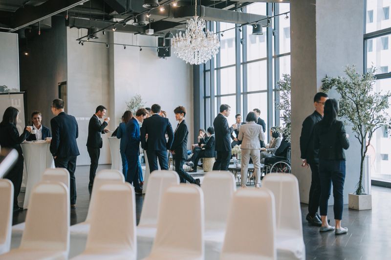 Asian Multiethnic business people talk during a coffee break in Seminar Business conference