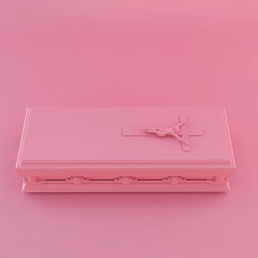 Pink coffin with crucifix on top.