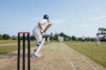A batsman ready to face a delivery in cricket.