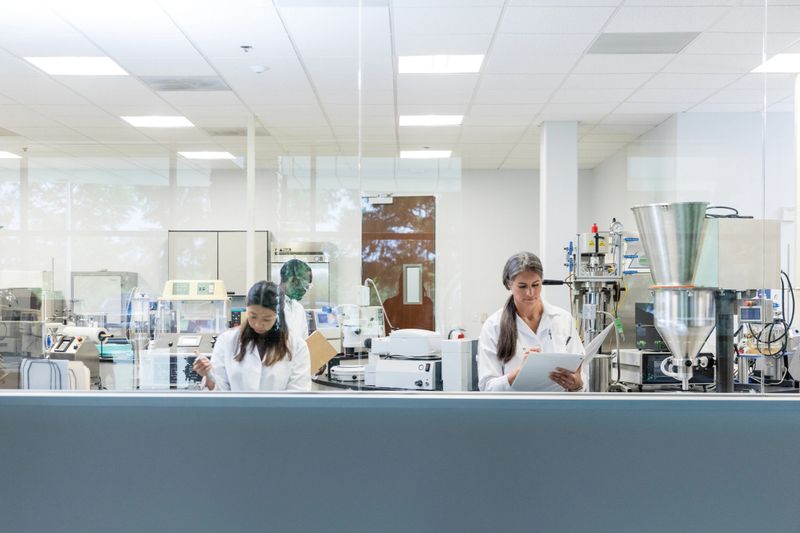 A diverse group of scientists work on cutting-edge pharmaceuticals in the laboratory.