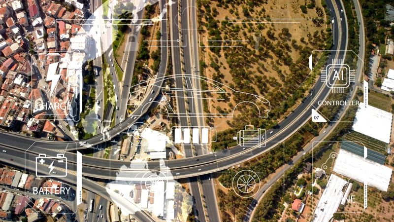 Intelligent Vehicles Cars Communicating Ai Logistic Autonomous Delivery Vehicles IoT GPS Tracking Satellite 5G Smart Roads Traffic Road Junction Interchange Motorway Triangulation Of Traffic Data. High quality photo