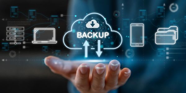 Digital cloud backup concept with hand and tech icons.