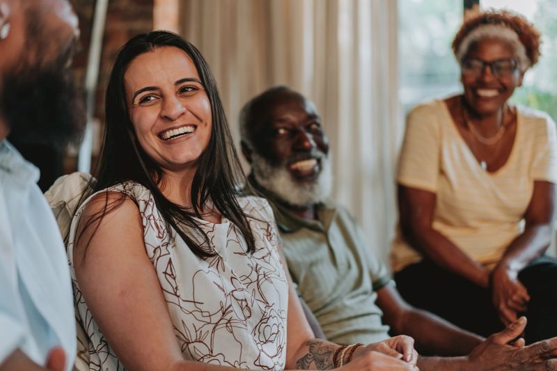 Family together talking on the sofa