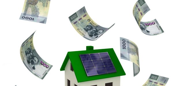 Model house with solar panels surrounded by floating currency notes.