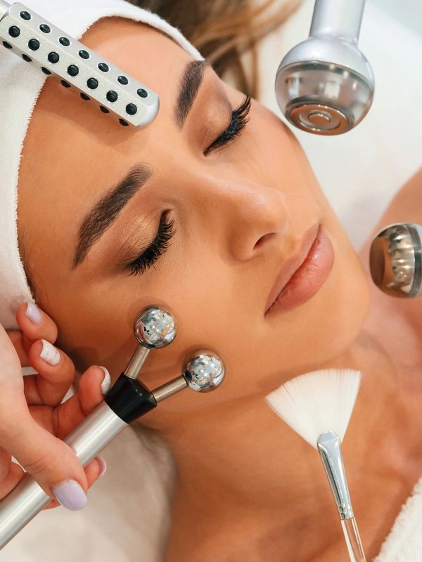 Woman having face massage
