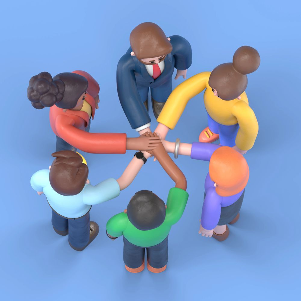 Six diverse cartoon figures join hands in unity on a blue background.