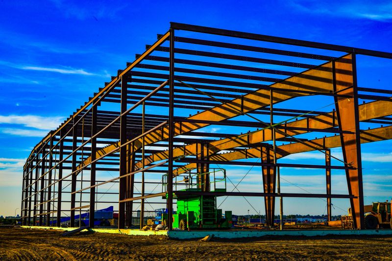 Steel framework coming together  for new commercial building for expanding business.