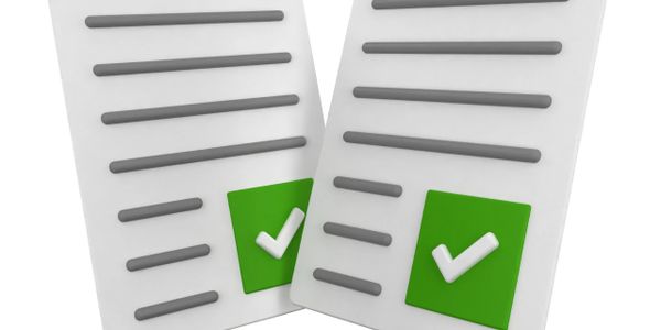 Two documents with green checkmarks indicating approval or completion.