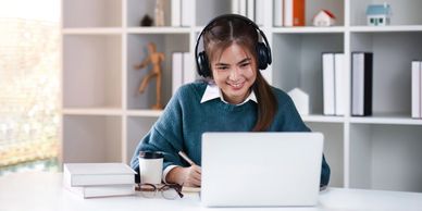 Young girl receiving an online tutoring session on her laptop. Personalized language learning for En