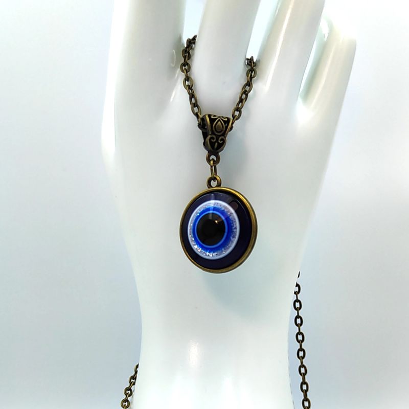 DIY costume jewelry pendant made with your own hands from accessories and beads, do it yourself, master jeweler. Overview of Goth Decoration. Eye of Fatima amulet