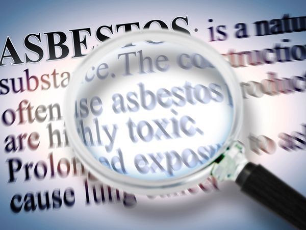 Magnified text highlighting asbestos as a highly toxic substance.