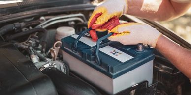 battery being put into car 