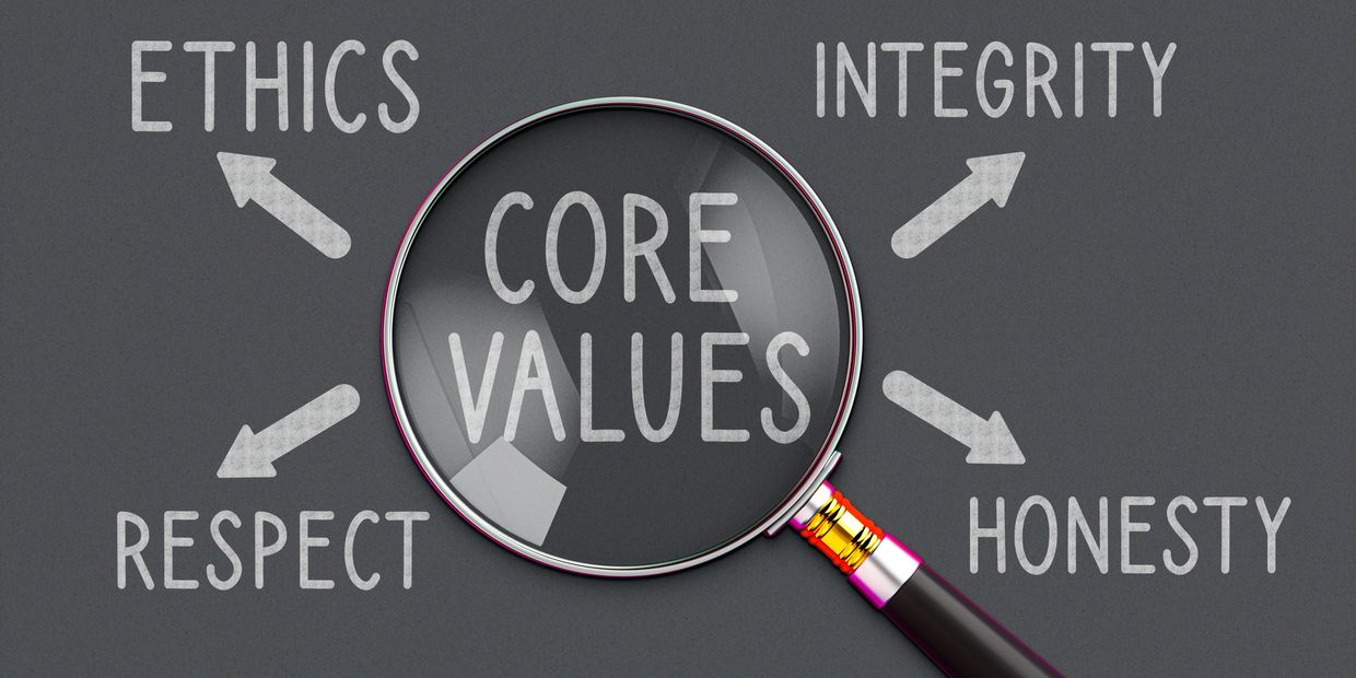 Magnifying glass showing the core values of our services.