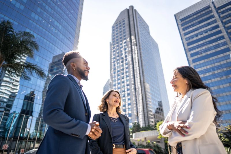 Business people talking outdoors