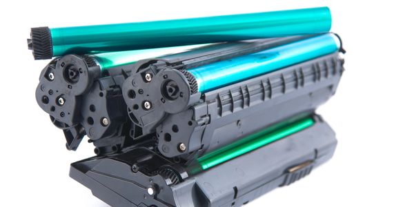 Colorful highlighters and notebooks arranged neatly on a white surface.