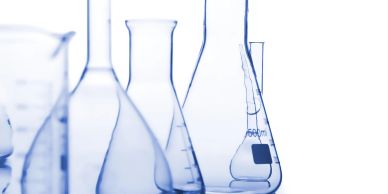Close-up of laboratory glassware with liquid.
