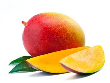 Fresh ripe mango with green leaves.